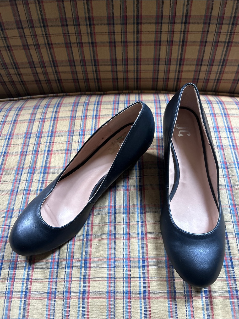 Black leather pumps